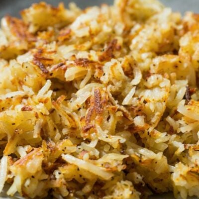 Plate of finished fried homemade hash browns from homemade frozen hash browns.