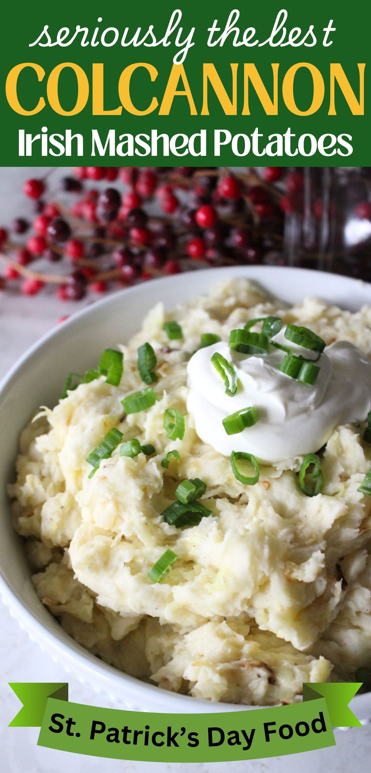 Finished bowl of homemade colcannon potatoes topped with sour cream and green onions. A text overlay reads seriously the best colcannon irish mashed potatoes st patricks day food