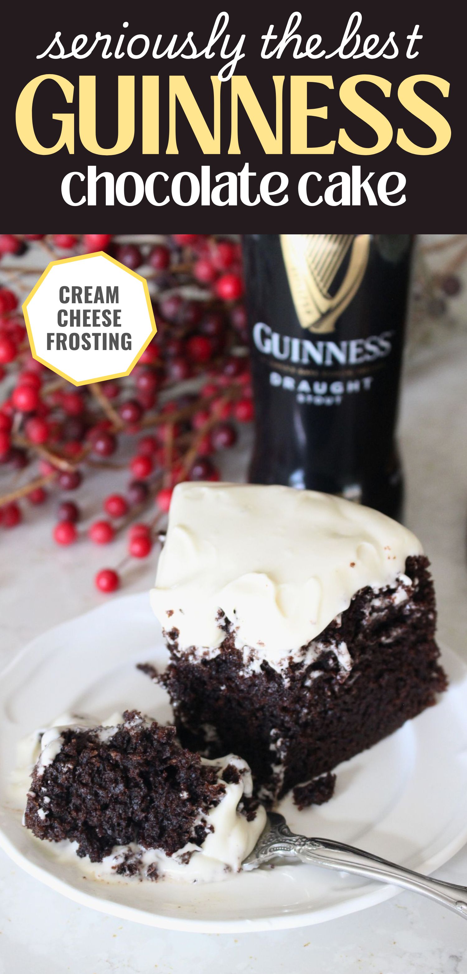 A finished slice of guinness chocolate cake with cream cheese frosting on a white plate. A forkful has been removed from the cake and it sitting on the plate in front. A bottle of Guinness Draught in the background. A text overlay reads seriously the best guinness chocolate cake cream cheese frosting
