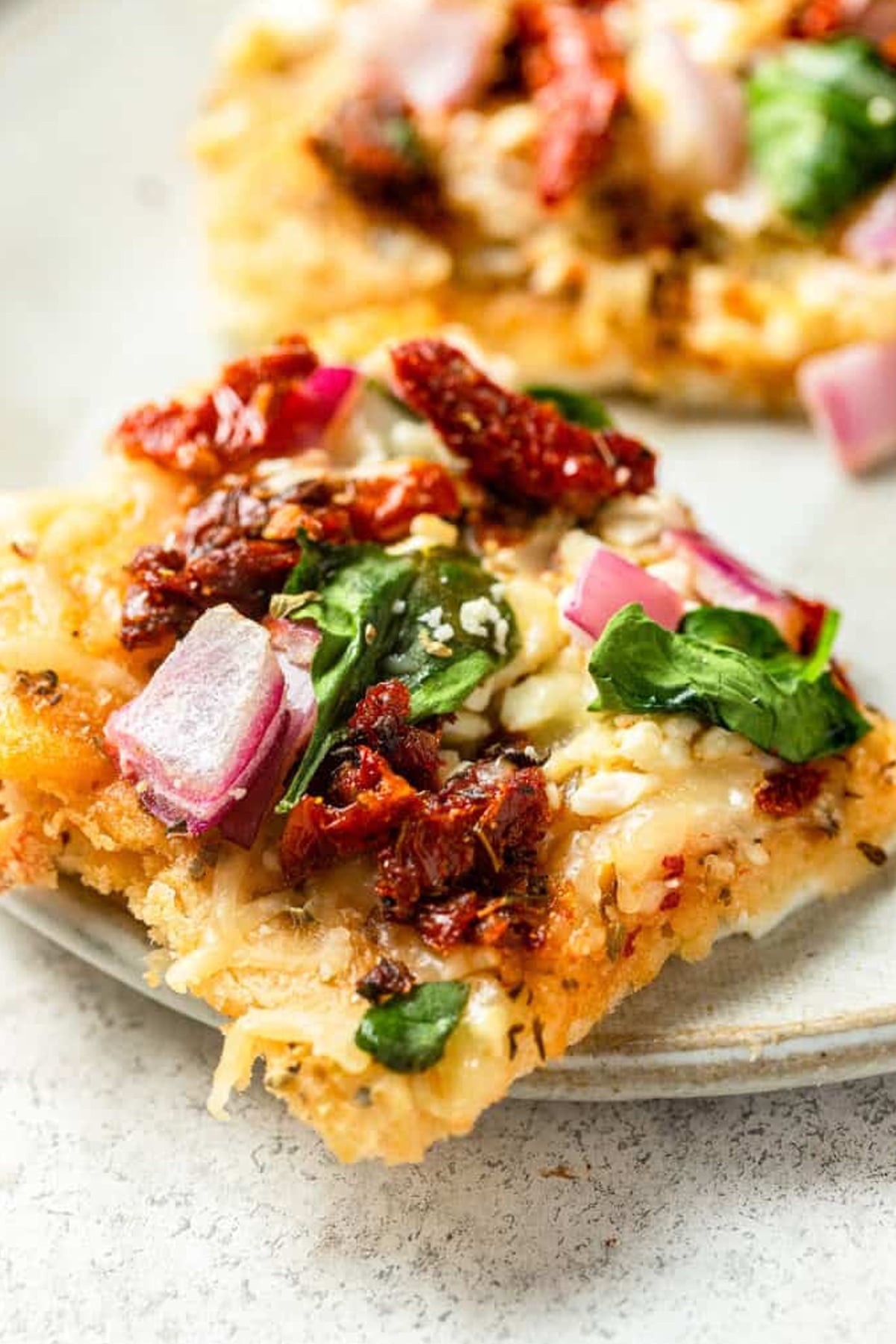 Close up of a slice of Mediterranean Egg White Pizza
