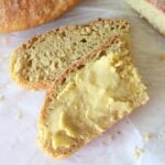 2 slices of homemade einkorn peasant bread with butter