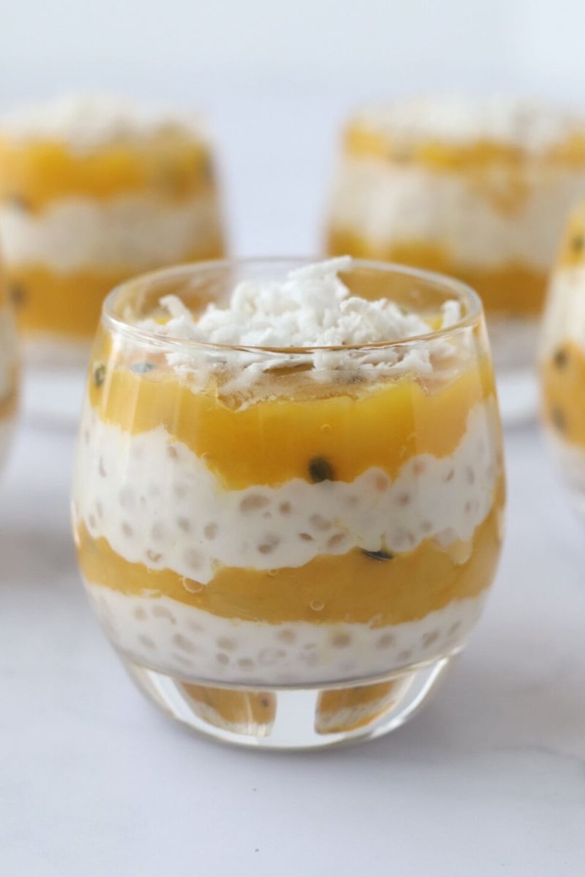 Coconut Mango Sago Tapioca Pudding in a small pudding cup