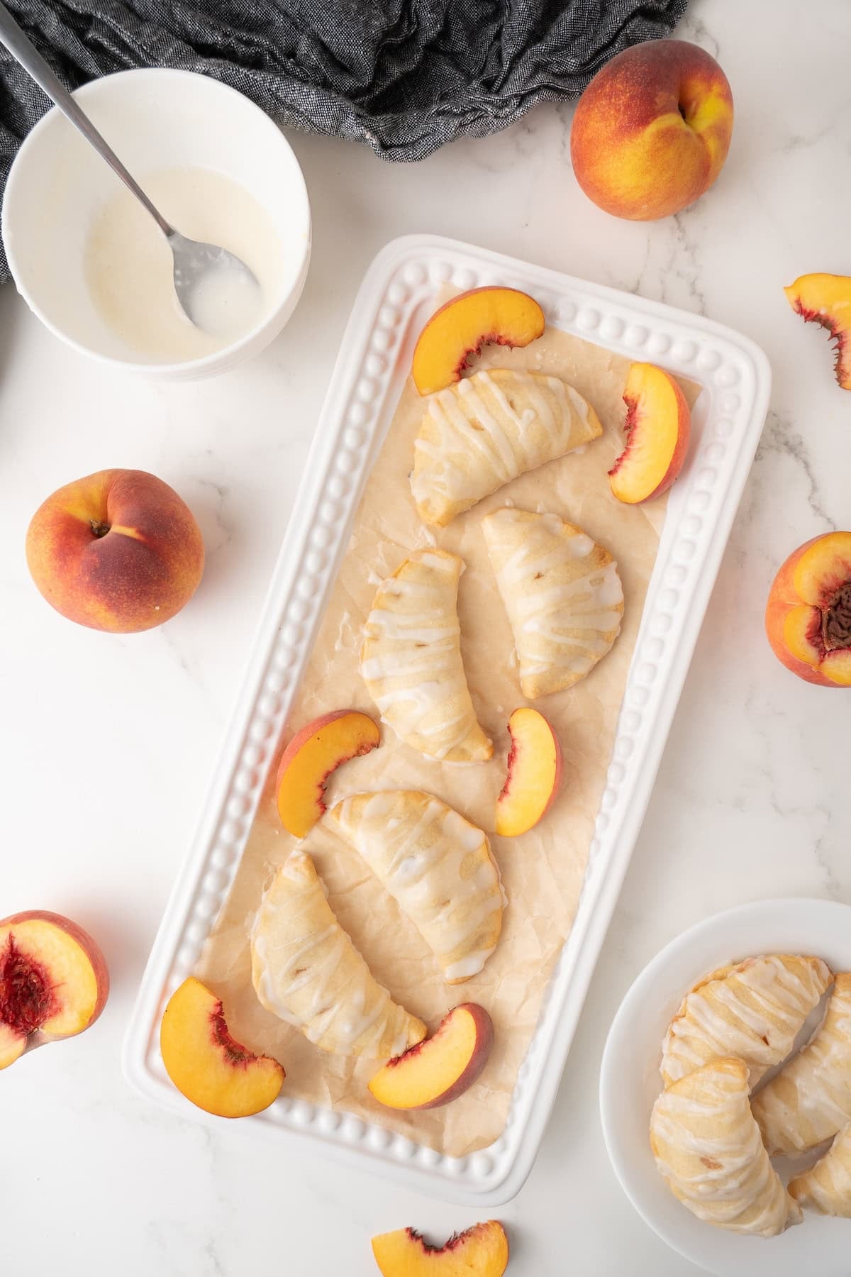 top down view of Peach Hand Pies on a white plate