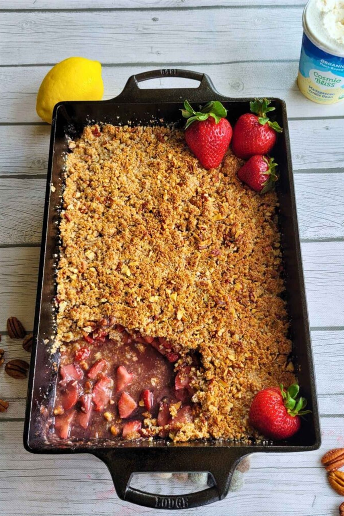 Strawberry crumble finished in a large cast iron baking pan