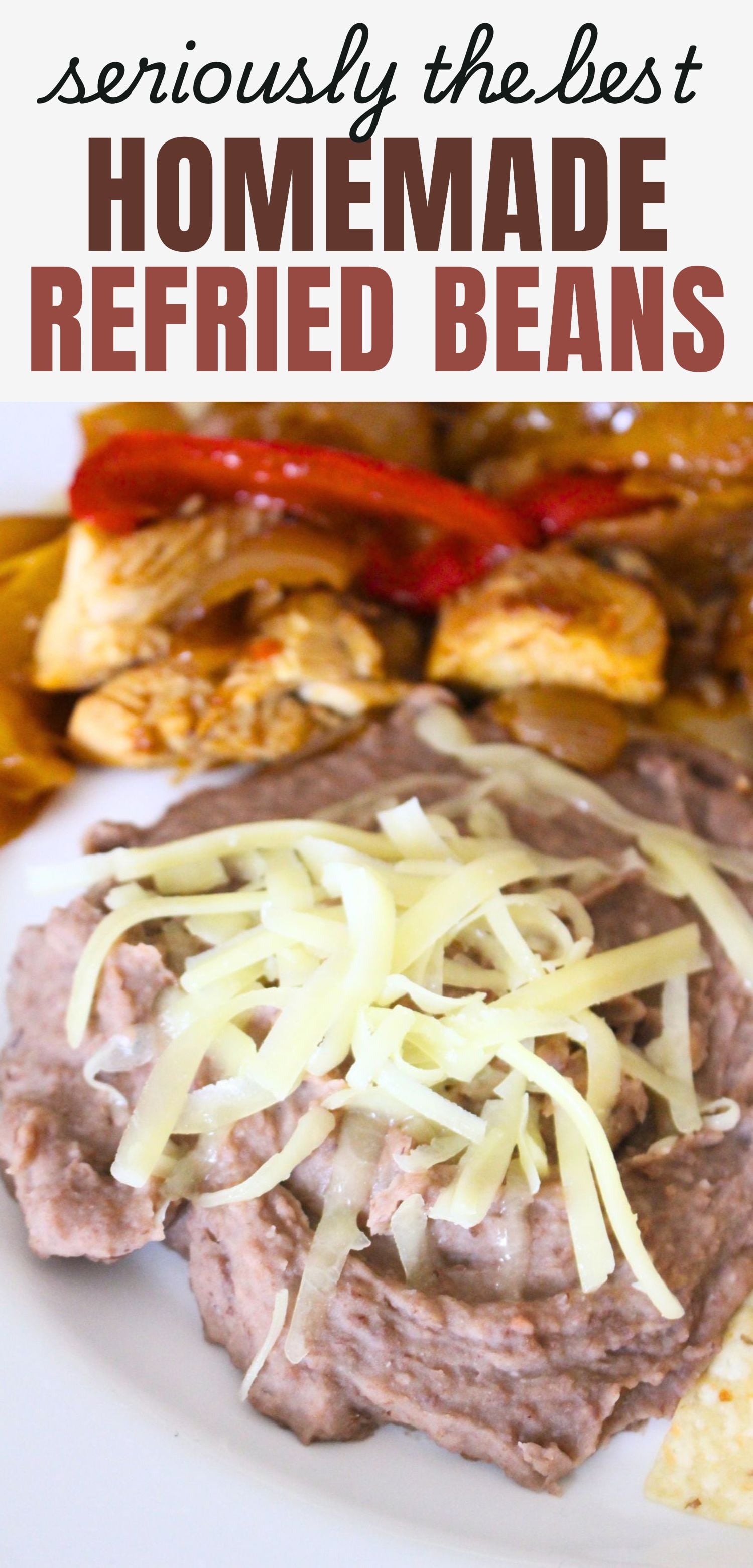 Finished refried beans on a plate, topped with cheese. Chicken fajitas in the background. a text overlay reads seriously the best homemade refried beans