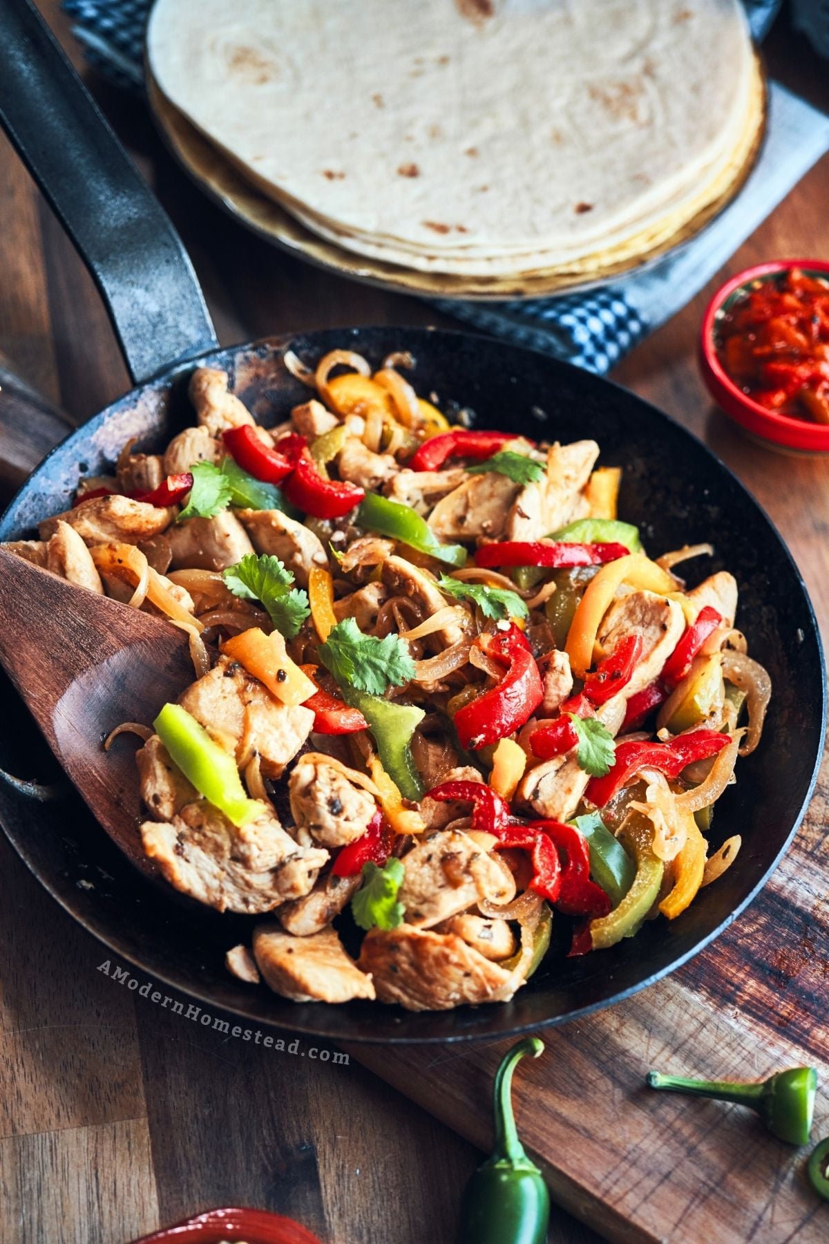 Skillet full of chicken fajitas finished and ready to serve.