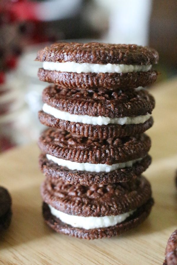 Stack of homemade oreos on a wooden counter
