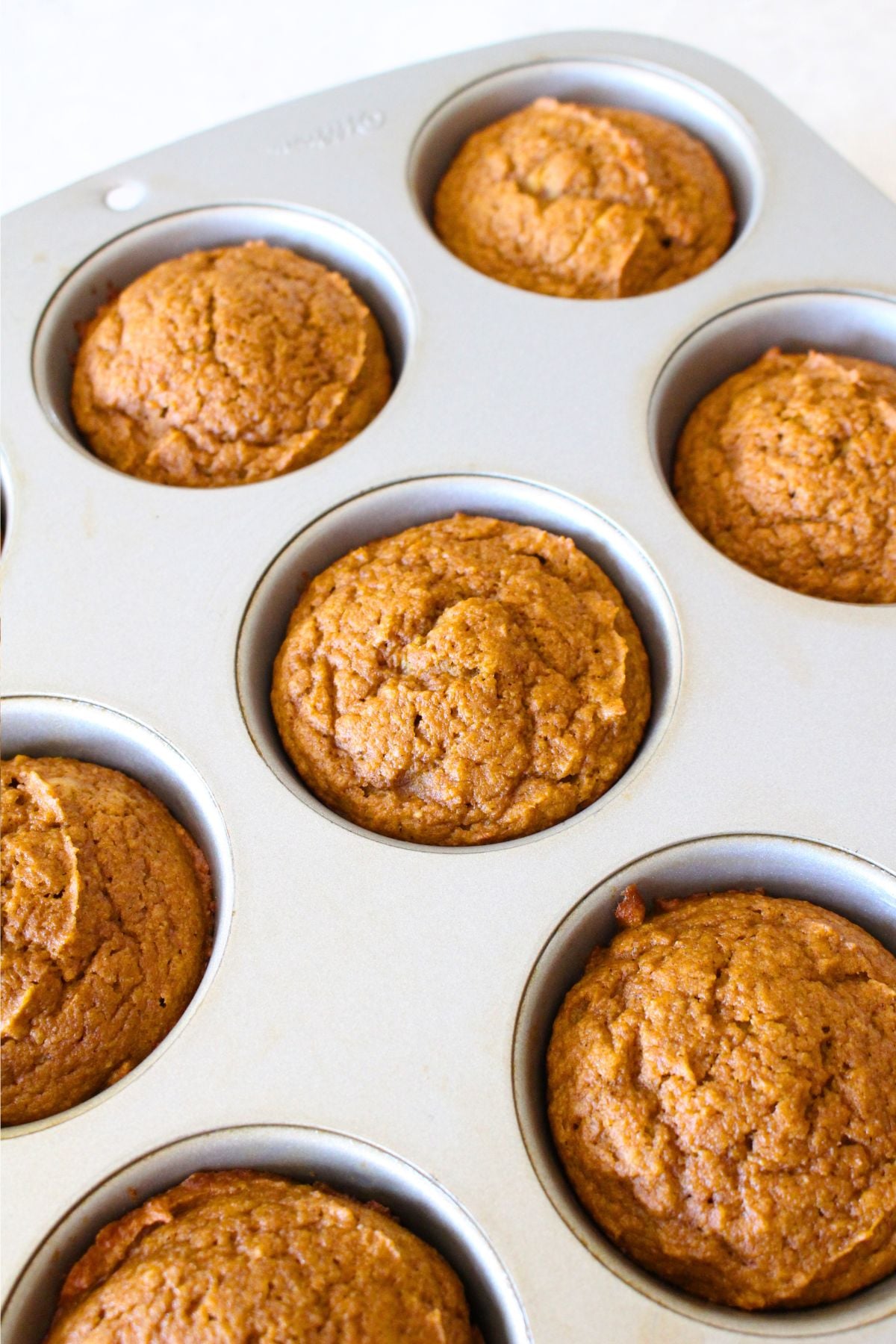 finished pumpkin muffins in a muffin tin