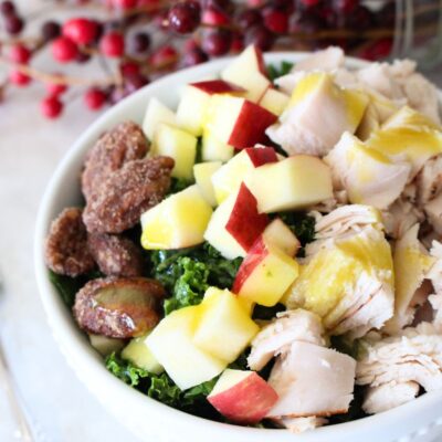 Finished turkey apple pecan kale salad in a white bowl